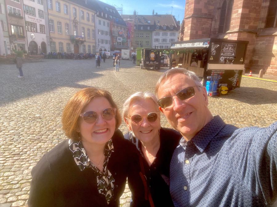 three people posing for a selfie in Freiburg