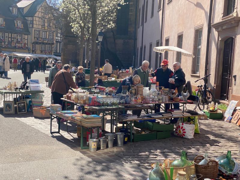 Street market with a backdrop of half-timbered houses