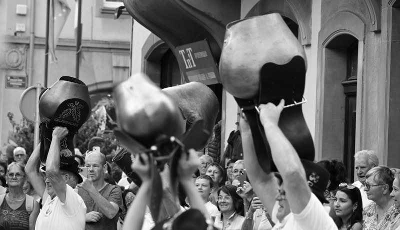 giant bells being swung above heads